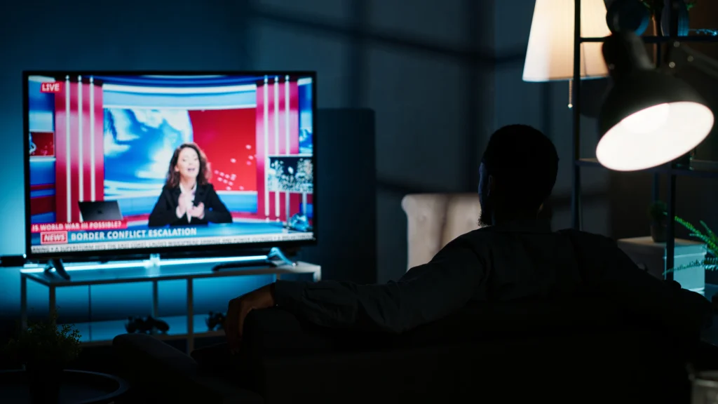 relaxed-person-watching-breaking-news-television-night (1)